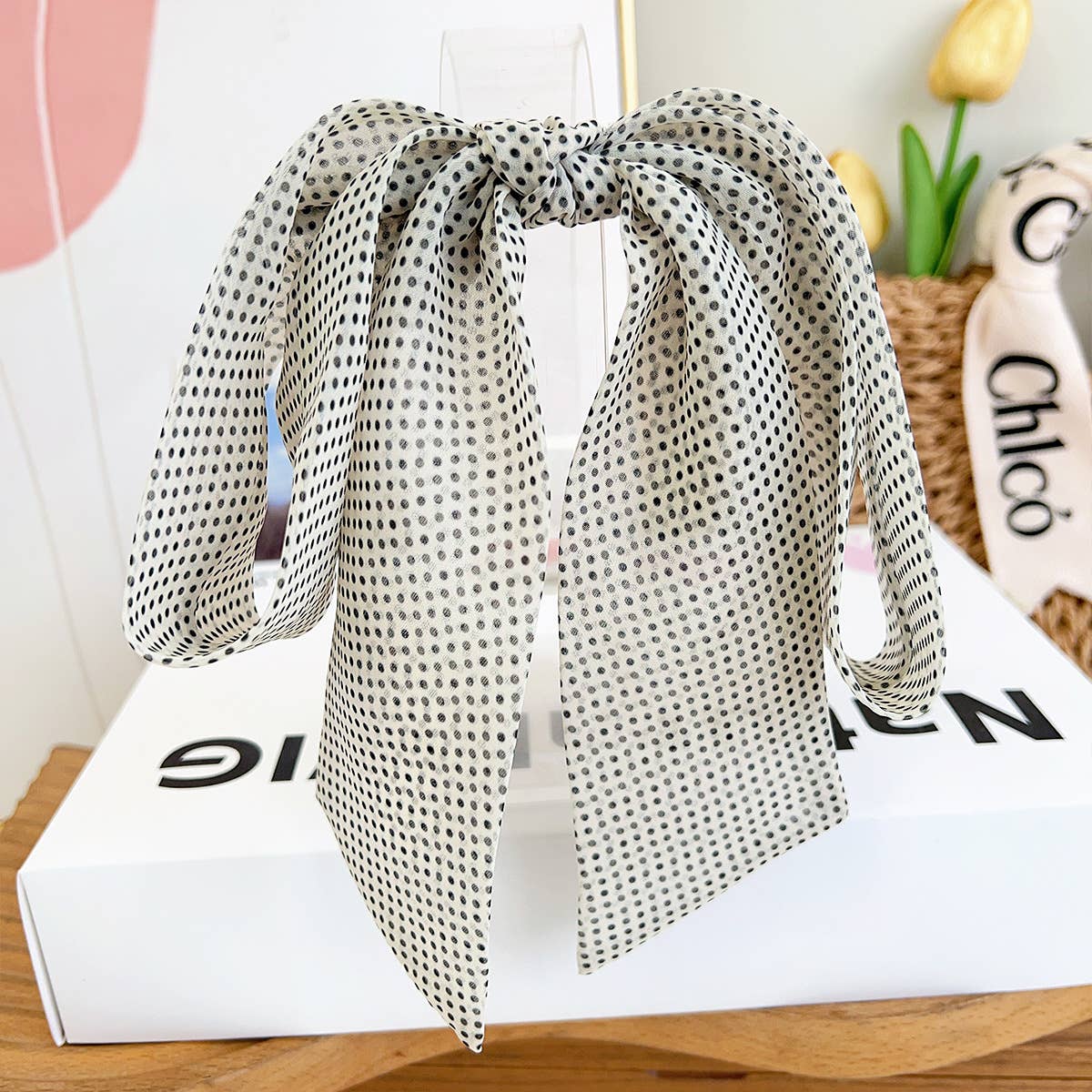 Discover delicate style with this petite French barrette showcasing an adorable black polka dot pattern on a white background. The silky satin bow features graceful long tails that dance with movement, adding feminine flair to any hairstyle. Its compact size makes it ideal for securing smaller sections, delicate updos, or creating charming accent details. Whether you're dressing up or adding a subtle touch of whimsy to your day, this sweet barrette brings timeless elegance.