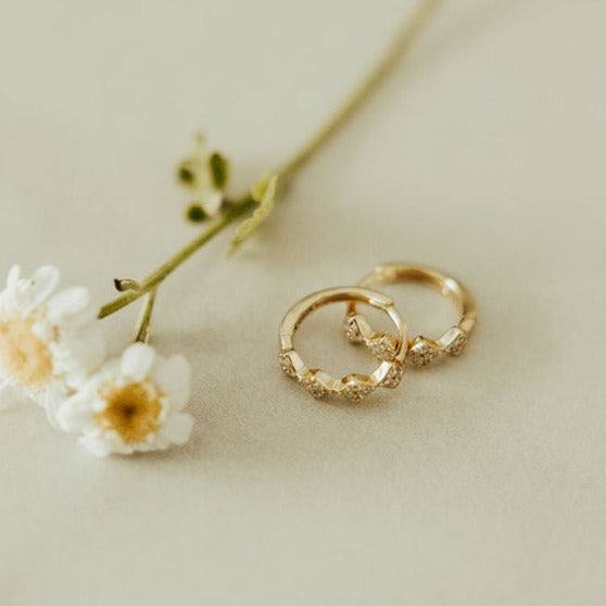 These Alice Diamond hoops are the perfect accessory to complete any outfit. They are sterling silver based gold vermeil and are hypoallergenic, tarnish and wear resistant, and perfect for sensitive ears. They measure a dainty 10mm and are perfect for a first piercing or in an earring stack.