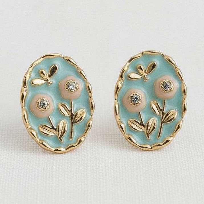 Elevate your style with these exquisite floral enamel drop earrings. Perfect for adding a touch of elegance to any outfit, these earrings feature a delicate design that captures the essence of vintage charm.

Elevate your accessory collection with these beautiful earrings that blend vintage charm with modern artistry.