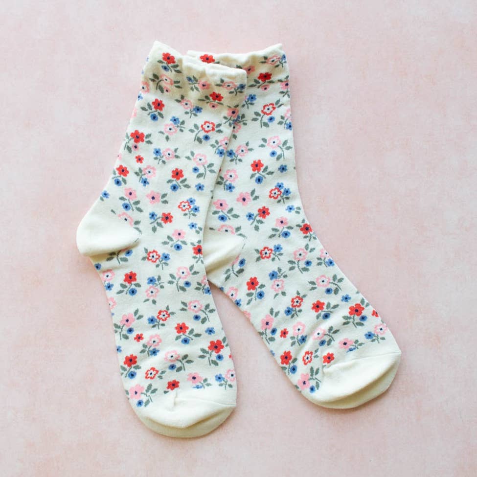 These Garden Flower Socks will add a touch of whimsy to your outfit with their ivory floral pattern. Made in a comfortable crew style, these socks will keep your feet cozy and stylish all day long. Perfect for the nature-lover or fashion-forward individual!

Details:

Adult Size
80% Cotton ,10% Spandex, 10% Polyester