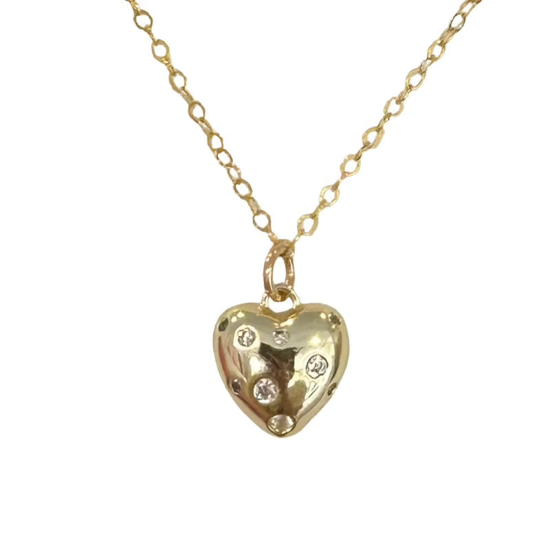 gold puffy heart with varying CZ crystals in different sizes and a gold filled chain