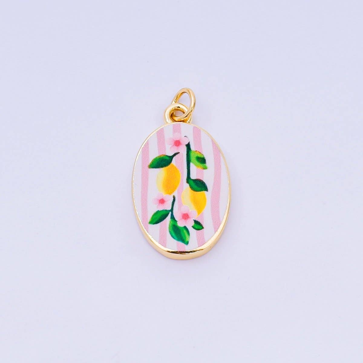 Brighten your jewelry collection with this vibrant Enamel Spring Collection Charm, featuring a pretty lemon enamel design on the front. Crafted from brass and 24K gold-filled materials with beautiful hand-painted enamel detailing, this petite charm measures 23.1mm x 14.1mm x 3.1mm—the perfect size for bracelets, necklaces, or charm collections. Lead-free and nickel-free, it's safe for sensitive skin and designed to last. A delightful accent piece.