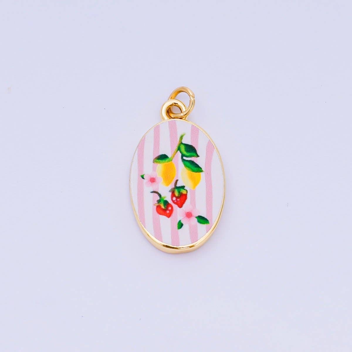 Brighten your jewelry collection with this vibrant Enamel Spring Collection Charm, featuring a petite lemon &amp; strawberry enamel design on the front. Crafted from brass and 24K gold-filled materials with beautiful hand-painted enamel detailing, this petite charm measures 23.1mm x 14.1mm x 3.1mm—the perfect size for bracelets, necklaces, or charm collections. Lead-free and nickel-free, it's safe for sensitive skin and designed to last. A delightful accent piece.