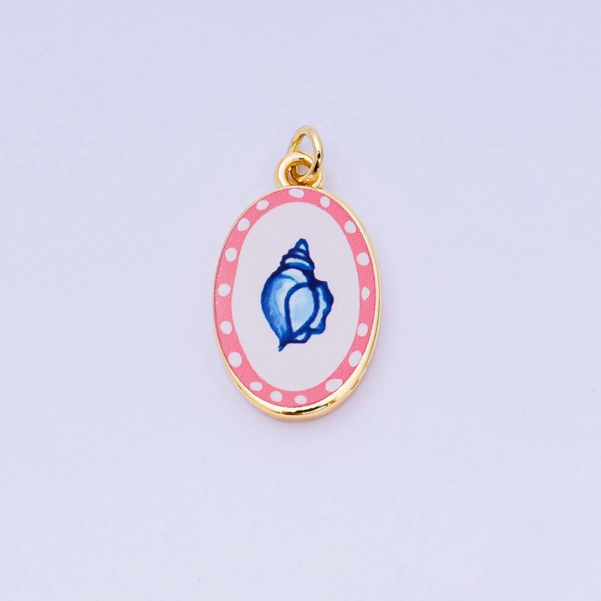 Brighten your jewelry collection with this vibrant Enamel Spring Collection Charm, featuring a conch shell design on the front. Crafted from brass and 24K gold-filled materials with beautiful hand-painted enamel detailing, this petite charm measures 23.1mm x 14.1mm x 3.1mm—the perfect size for bracelets, necklaces, or charm collections. Lead-free and nickel-free, it's safe for sensitive skin and designed to last. A delightful accent piece.