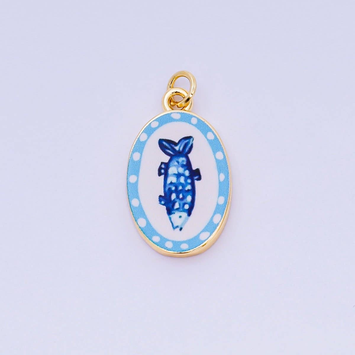 Brighten your jewelry collection with this vibrant Enamel Spring Collection Charm, featuring a blue fish design on the front. Crafted from brass and 24K gold-filled materials with beautiful hand-painted enamel detailing, this petite charm measures 23.1mm x 14.1mm x 3.1mm—the perfect size for bracelets, necklaces, or charm collections. Lead-free and nickel-free, it's safe for sensitive skin and designed to last. A delightful accent piece.