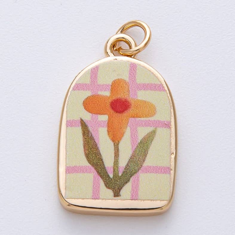Brighten your jewelry collection with this delicate orange flower charm. Crafted from brass and 24K gold-filled materials, this petite piece features vibrant enamel detailing that captures the warmth of a blooming blossom. Perfect for bracelets, necklaces, or charm collections by Salt & Honey Charmed.