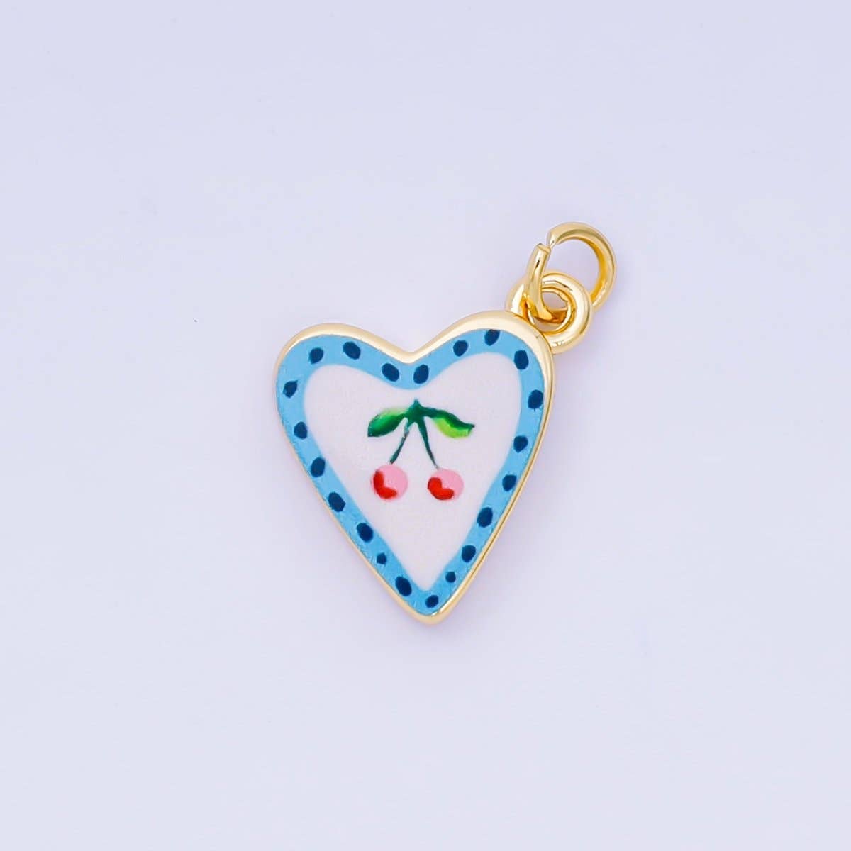 A delicate heart-shaped charm adorned with cherries in soft, romantic detail. Crafted from brass with 24K gold-filled plating and vibrant enamel work, this piece combines elegance with durability. Perfect for charm bracelets, necklaces, or jewelry customization projects. Lead-free and nickel-free for safe, comfortable wear.