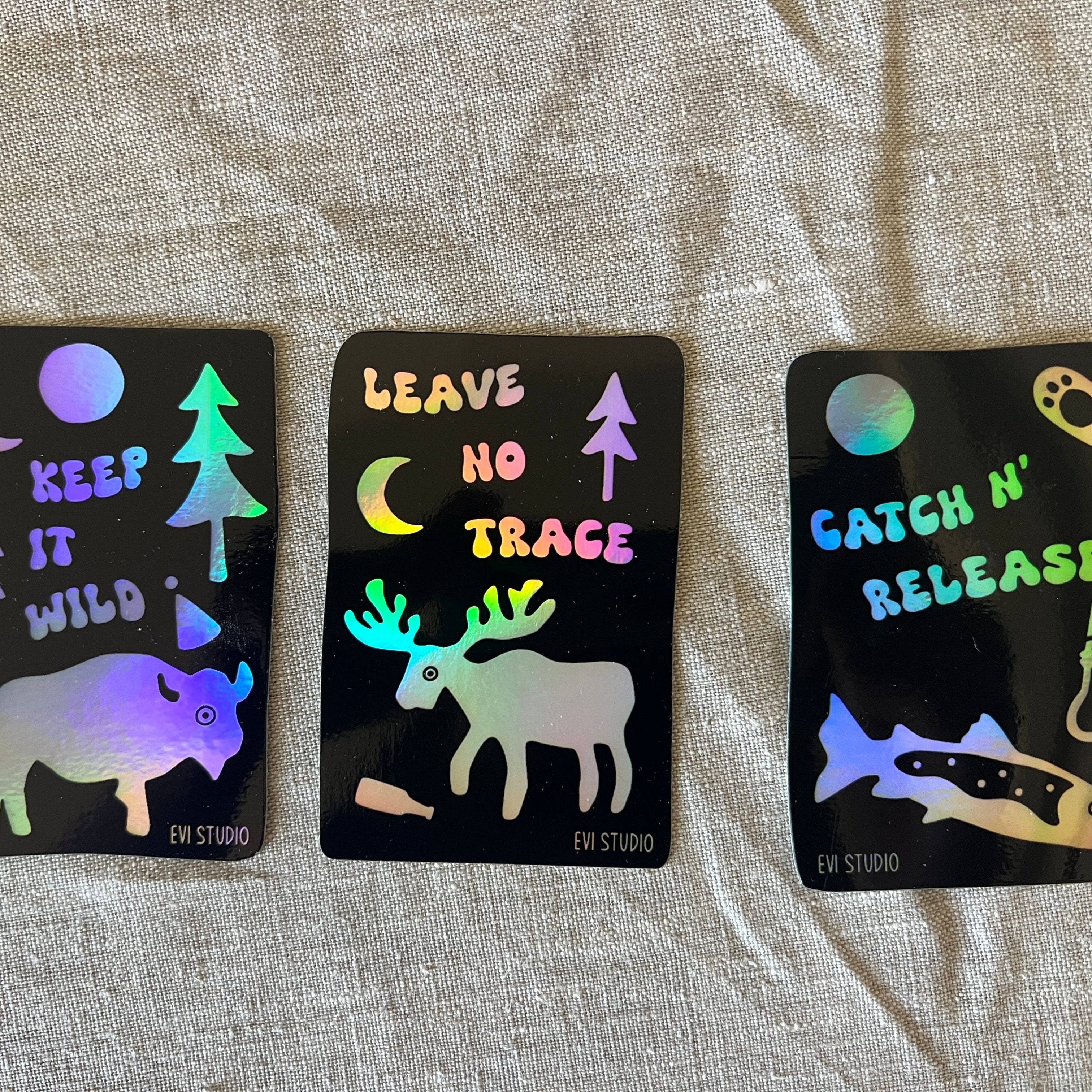 "Keep It Wild" and "Leave No Trace" and "Catch And Release" black and holographic stickers
