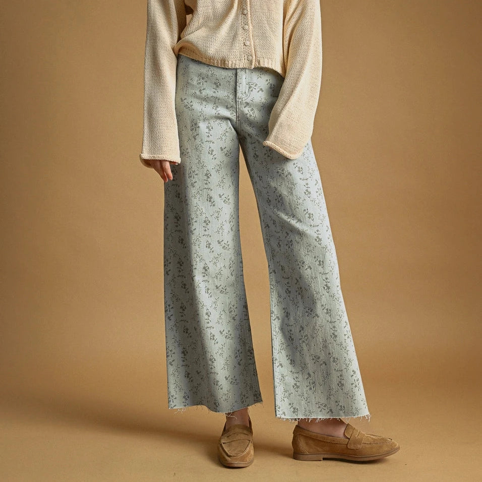 Embrace effortless elegance with these Floral Print Stretched Pants in soothing blue hues. Crafted from a breathable cotton-spandex blend, they offer gentle stretch and all-day comfort. The wide-leg silhouette flatters every frame while the delicate floral pattern adds a touch of warmth and personality to your everyday wardrobe. Perfect for those who value both style and ease.