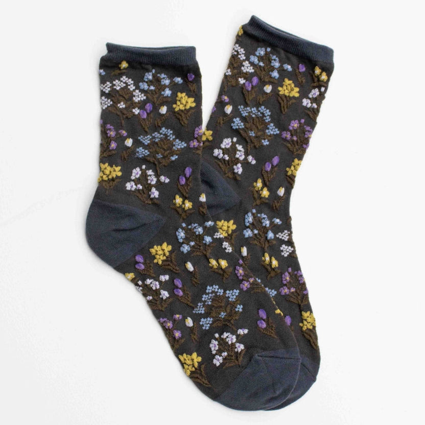 Step into nature’s charm with these embroidered floral crew socks. Designed with delicate wildflower patterns, they add a whimsical touch to your everyday outfits while offering comfort and durability.

Perfect for pairing with sneakers, loafers, or boots, these floral socks bring a fresh and playful accent to any look.