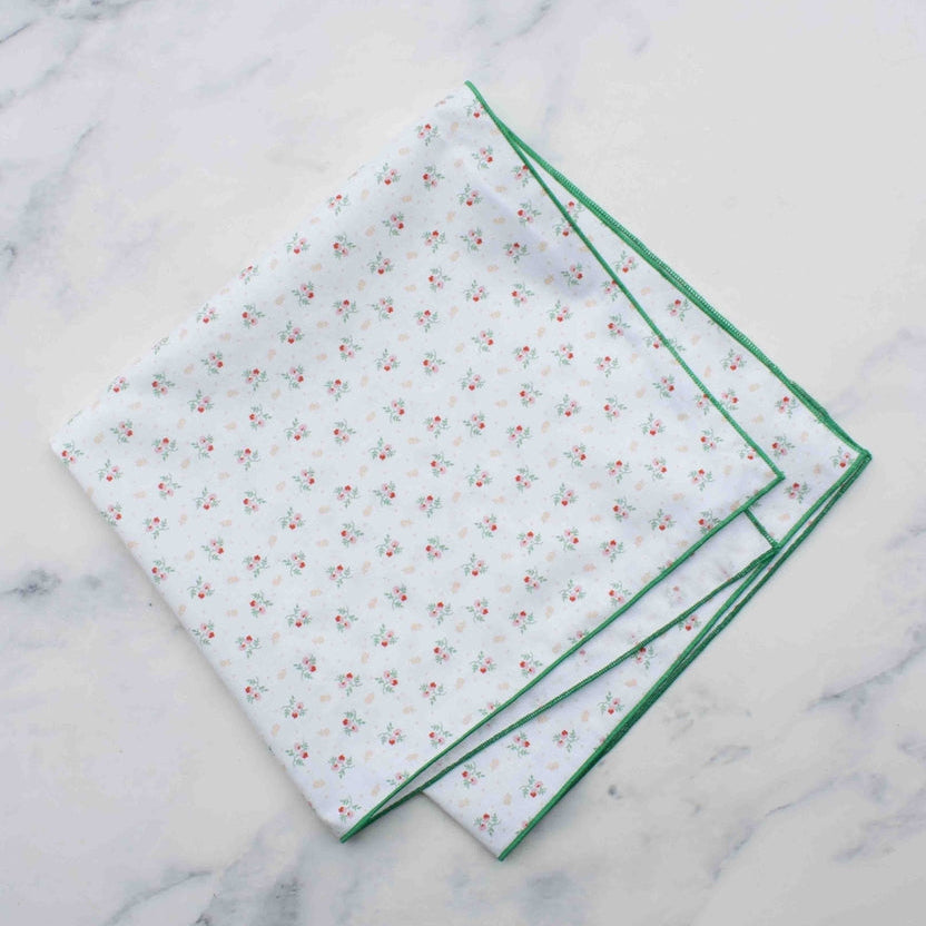 Sweet and subtle, the Mini Rosebud square scarf brings a soft vintage charm to your style. Made from 100% lightweight cotton and measuring approximately 17 inches, it features an all-over petite rose pattern on either a crisp white or playful pink background. Finished with fine stitched edges, it’s perfect for tying around your neck, wrist, or bag for a gentle, romantic touch.