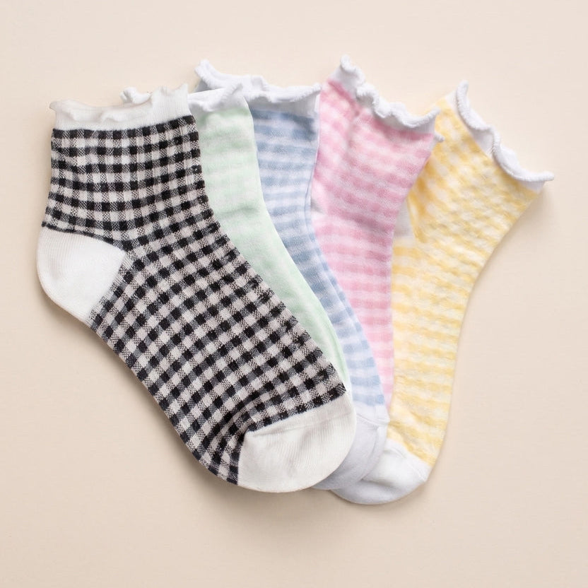 Add a soft, playful touch to your everyday look with these pastel gingham ankle socks. Designed with a delicate ruffle trim and subtle check pattern, they bring a charming, feminine feel while staying comfortable for all-day wear. The breathable cotton blend keeps your feet cool and cozy, while the stretch ensures a secure, flexible fit.

Perfect for pairing with sneakers, flats, or loafers, these socks are an easy way to add a pop of color and texture to any outfit.