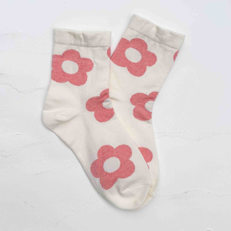 Bring a playful vintage touch to your everyday wardrobe with these Retro Daisy Flower Crew Socks. Featuring oversized daisy blooms in cheerful colors, these soft and stretchy socks add effortless charm to any casual outfit. Designed for all-day comfort, they're perfect for pairing with sneakers, loafers, boots, or simply relaxing at home.