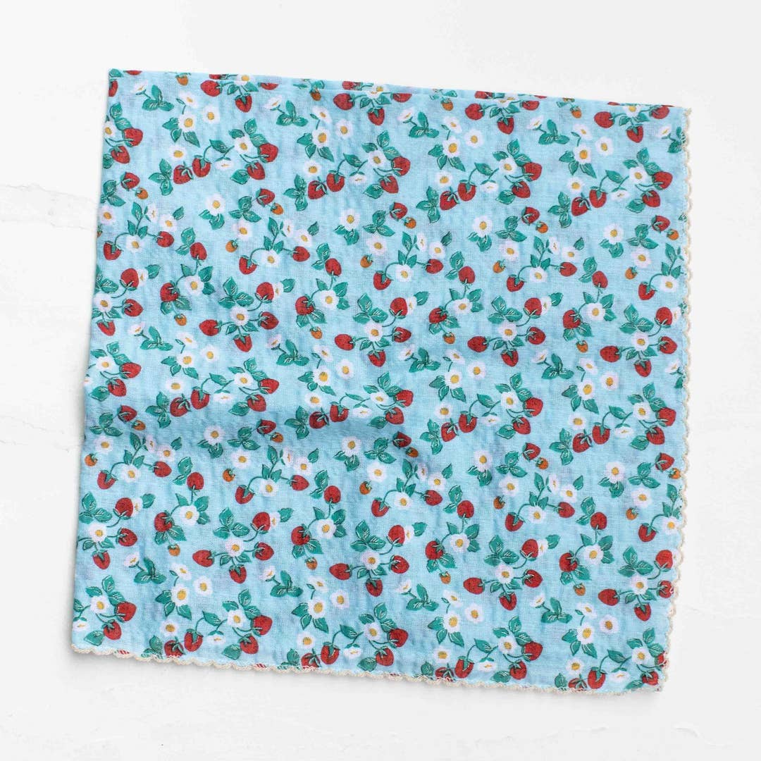 Add a charming touch to your everyday look with this sweet strawberry floral scarf. Featuring a delicate mix of strawberries, tiny blossoms, and soft greenery, this piece brings a fresh, vintage-inspired feel that’s perfect for any season. Crafted from a soft cotton-rayon blend, the fabric is lightweight, breathable, and gentle on the skin—ideal for versatile styling. Wear it as a neck scarf, hair accessory, bag accent, or even a petite wrap for effortless styling.