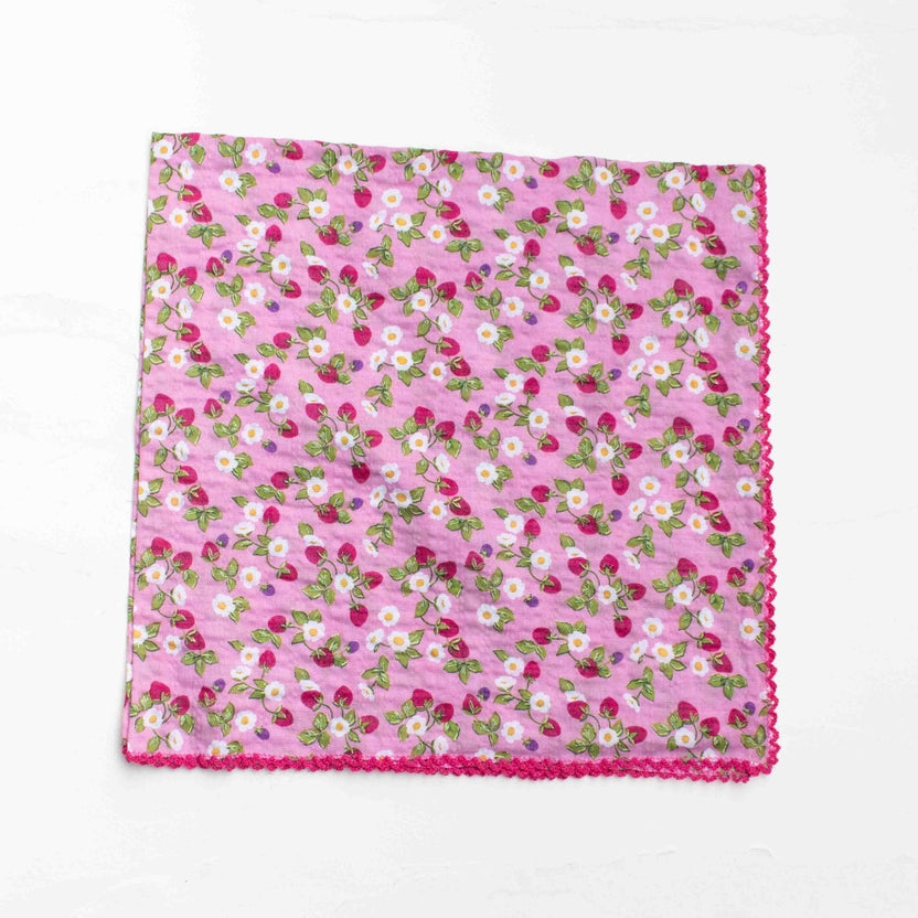 Add a charming touch to your everyday look with this sweet strawberry floral scarf. Featuring a delicate mix of strawberries, tiny blossoms, and soft greenery, this piece brings a fresh, vintage-inspired feel that’s perfect for any season. Crafted from a soft cotton-rayon blend, the fabric is lightweight, breathable, and gentle on the skin—ideal for versatile styling. Wear it as a neck scarf, hair accessory, bag accent, or even a petite wrap for effortless styling.