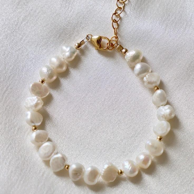 Our Kailani Bracelet is a beautiful beachy bracelet that is perfect to style everyday for this summer season. Made out of our freshwater nugget pearls and gold beaded accents, everyone will be asking you where you got your modern pearl bracelet.