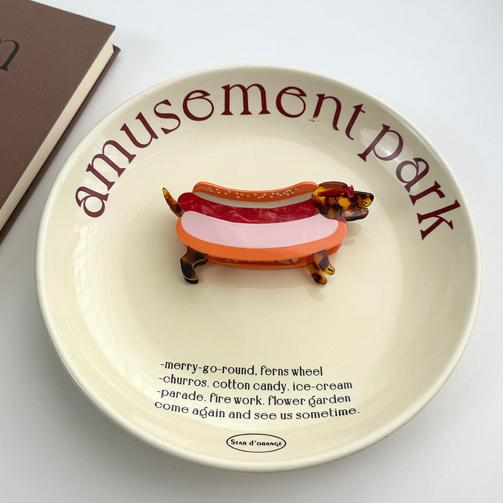 Add a playful, charming touch to hairstyles with these dachshund-shaped hair claws! Each claw is crafted into a cute dachshund silhouette adorned in a hotdog costumer, all set on a classic tortoiseshell base.

Crafted to hold hair gently yet firmly all day long. Perfect for casual daily wear, pet lover styling, or gifting to dachshund enthusiasts and fans of whimsical accessories.