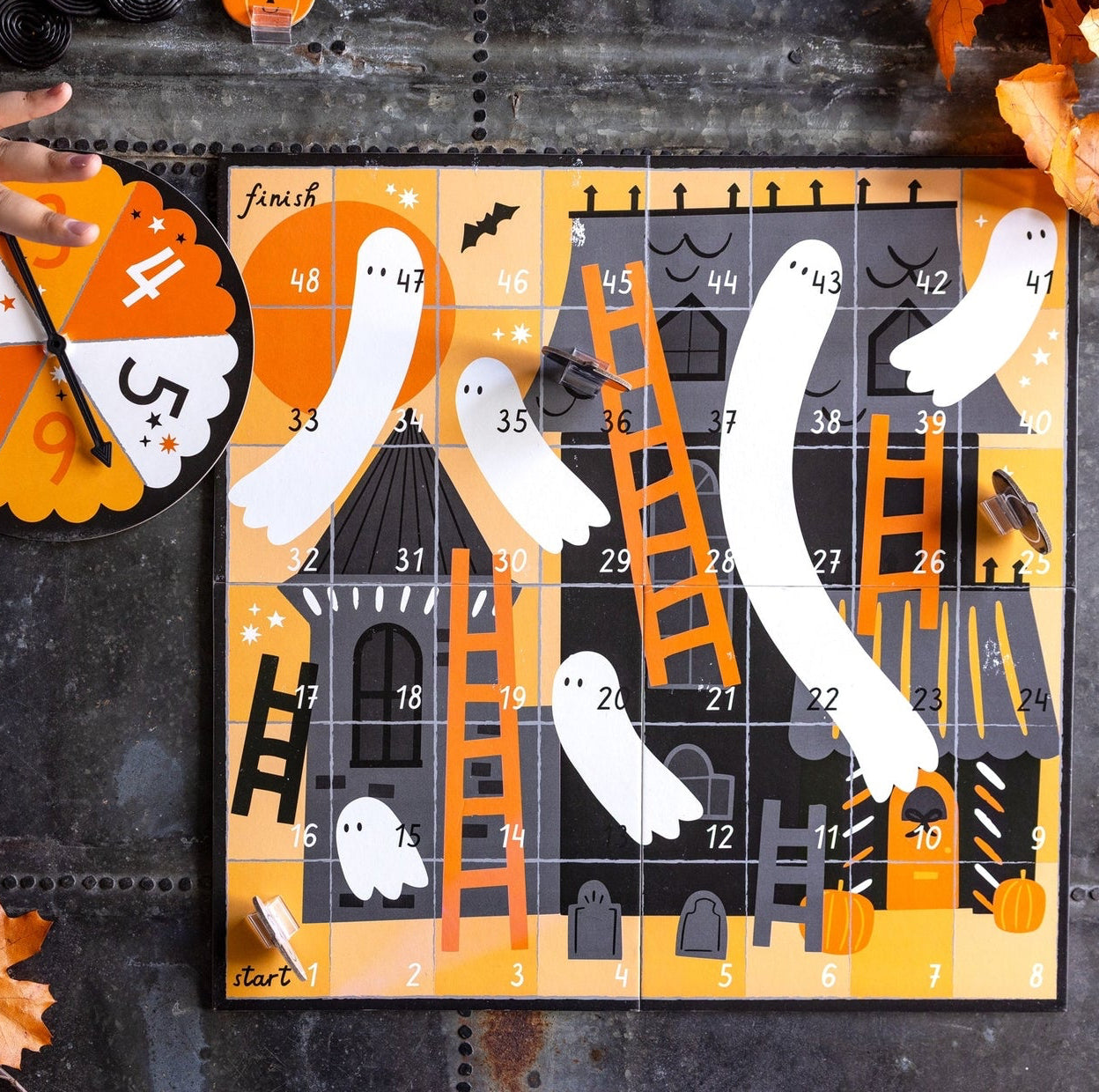 Step into the spooky fun with our Hey Boo Ghosts & Ladders Game! This Halloween twist on a classic board game brings ghostly excitement to family game night. Kids will squeal with delight as they race up ladders and slide down ghosts in this hauntingly entertaining adventure. Perfect for Halloween parties or anytime thrills!