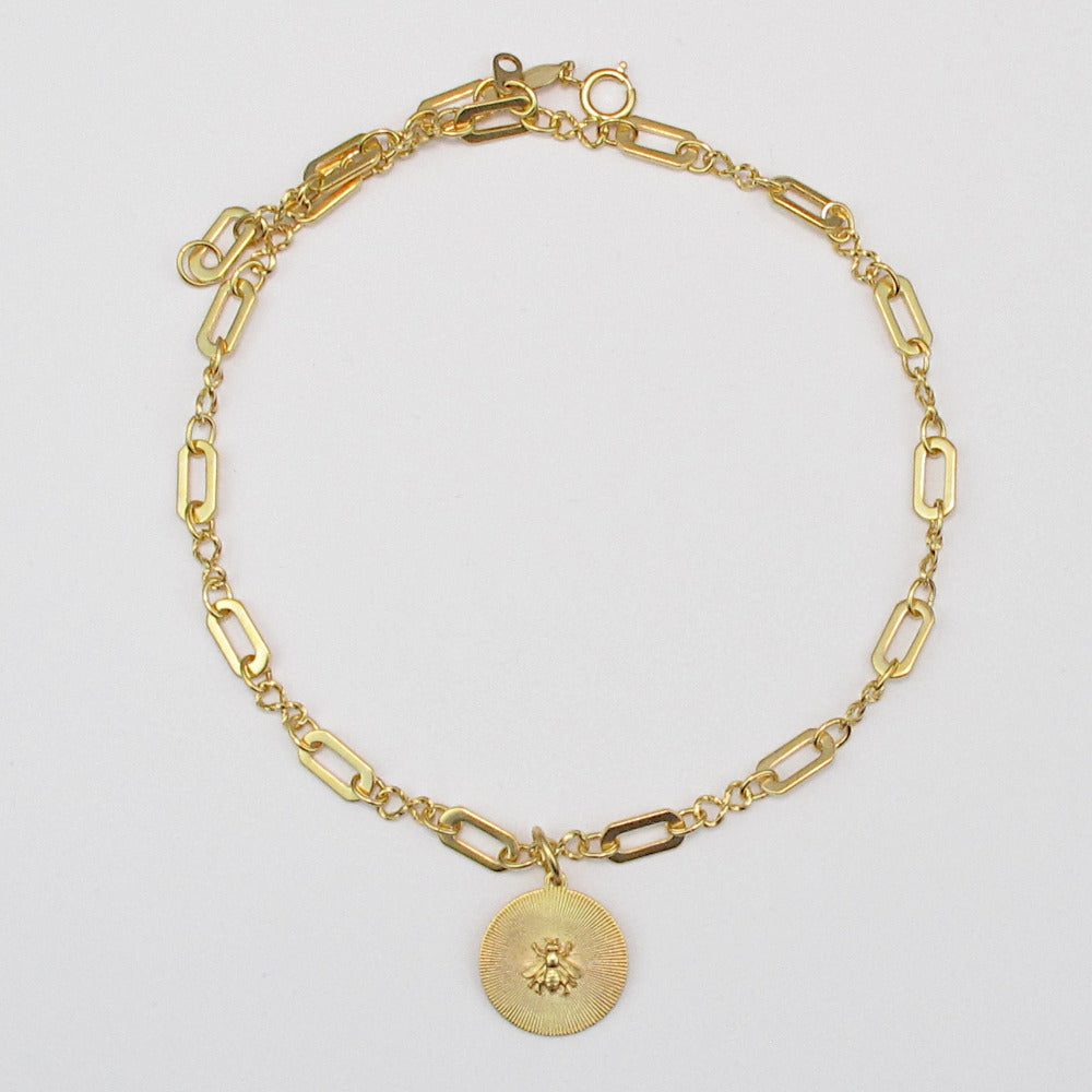 Because we can never get enough, our love of bees runs deep. This tiny flyer medallion is sure to become a favorite, it is ours! 14k gold finish.