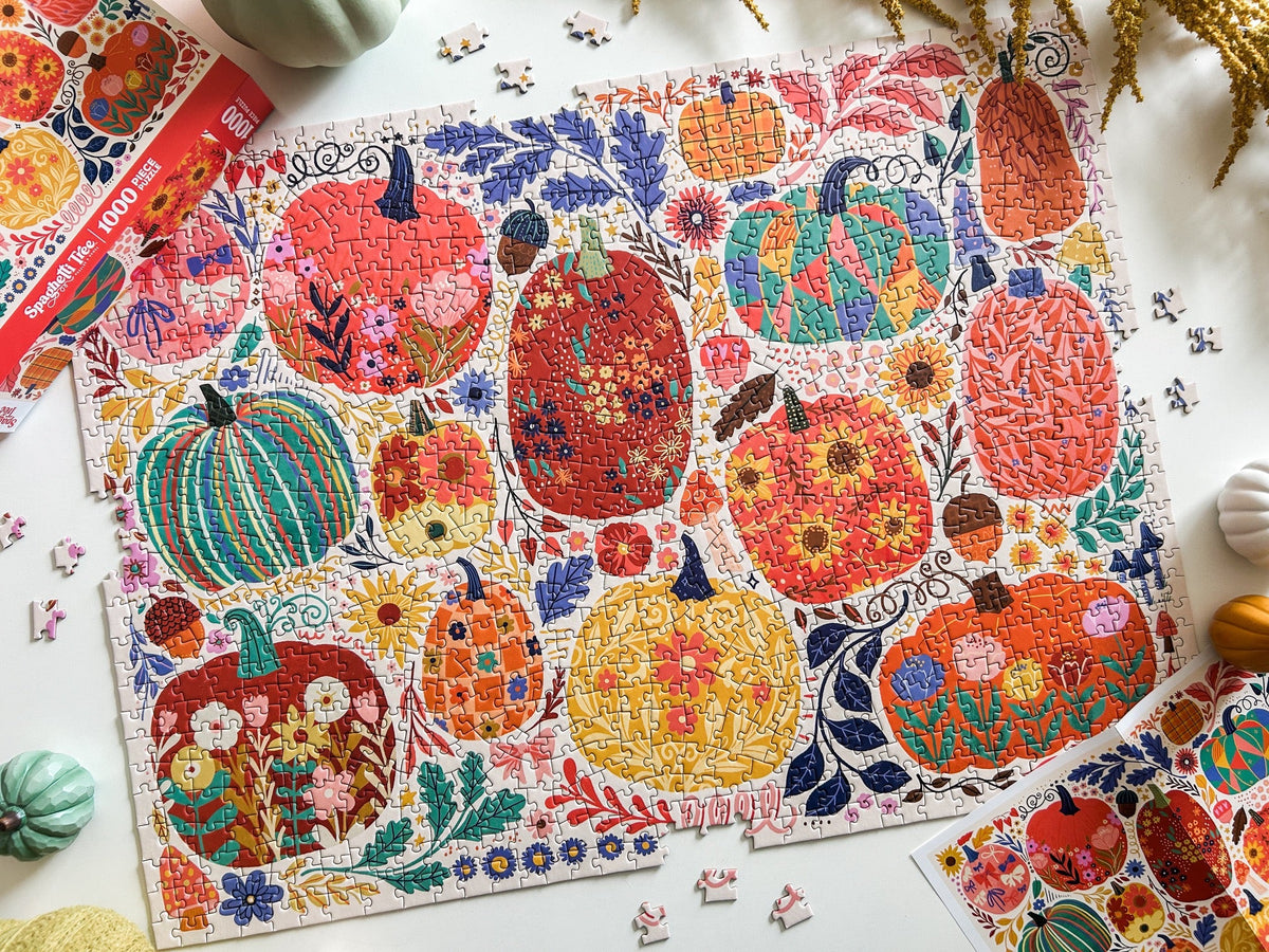 Above view of patchwork pumpkins puzzle. Graphics done in a patchwork style. Lots of cheerful pumpkins with cute and quirky designs. 