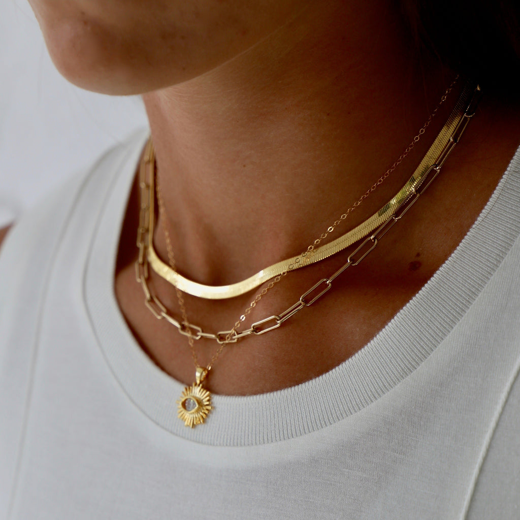 If you are looking to add a bold piece to your jewelry collection that can still be worn everyday, this is your necklace! Featuring a thick herringbone chain with a 2" extender, this necklace is one of our staples!
