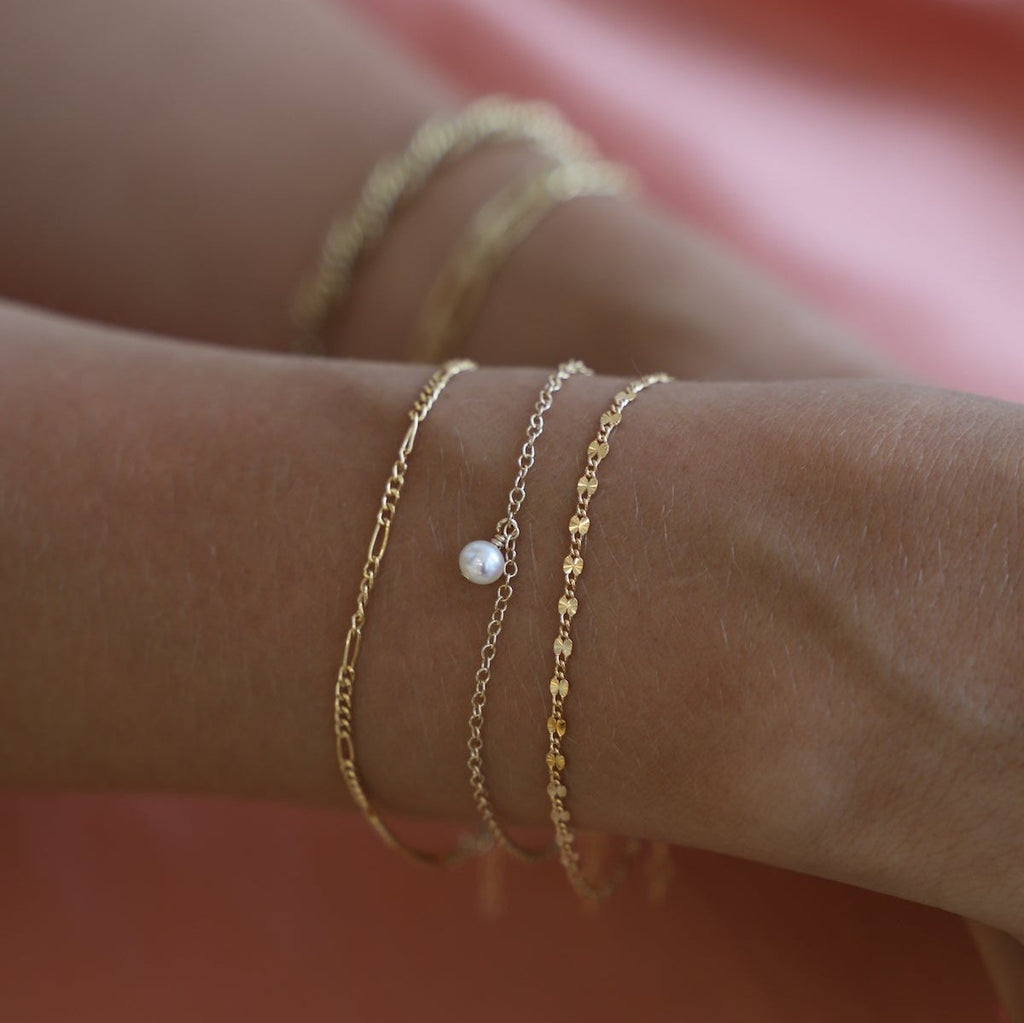 Delicate and modern, the Delicate Figaro Chain is crafted with gold filling for a sleek look. With its intricate design and high-quality materials, Figaro is a must-have for any fashion-forward individual.