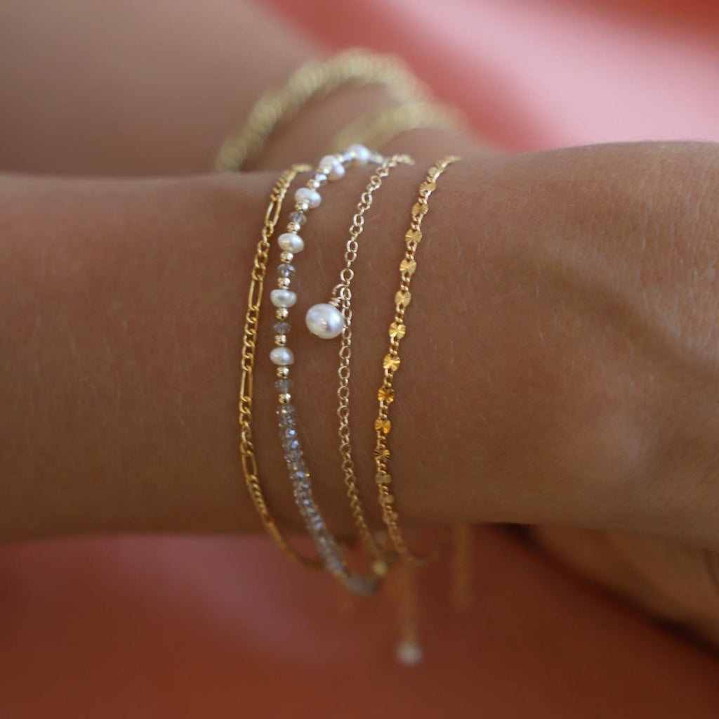 Be the belle of the beach with the Golden Sands Bracelet! A summery accessory made with sand-colored crystals and gold-filled and freshwater pearl beaded accents, this bracelet is just what you need to spruce up your look.
