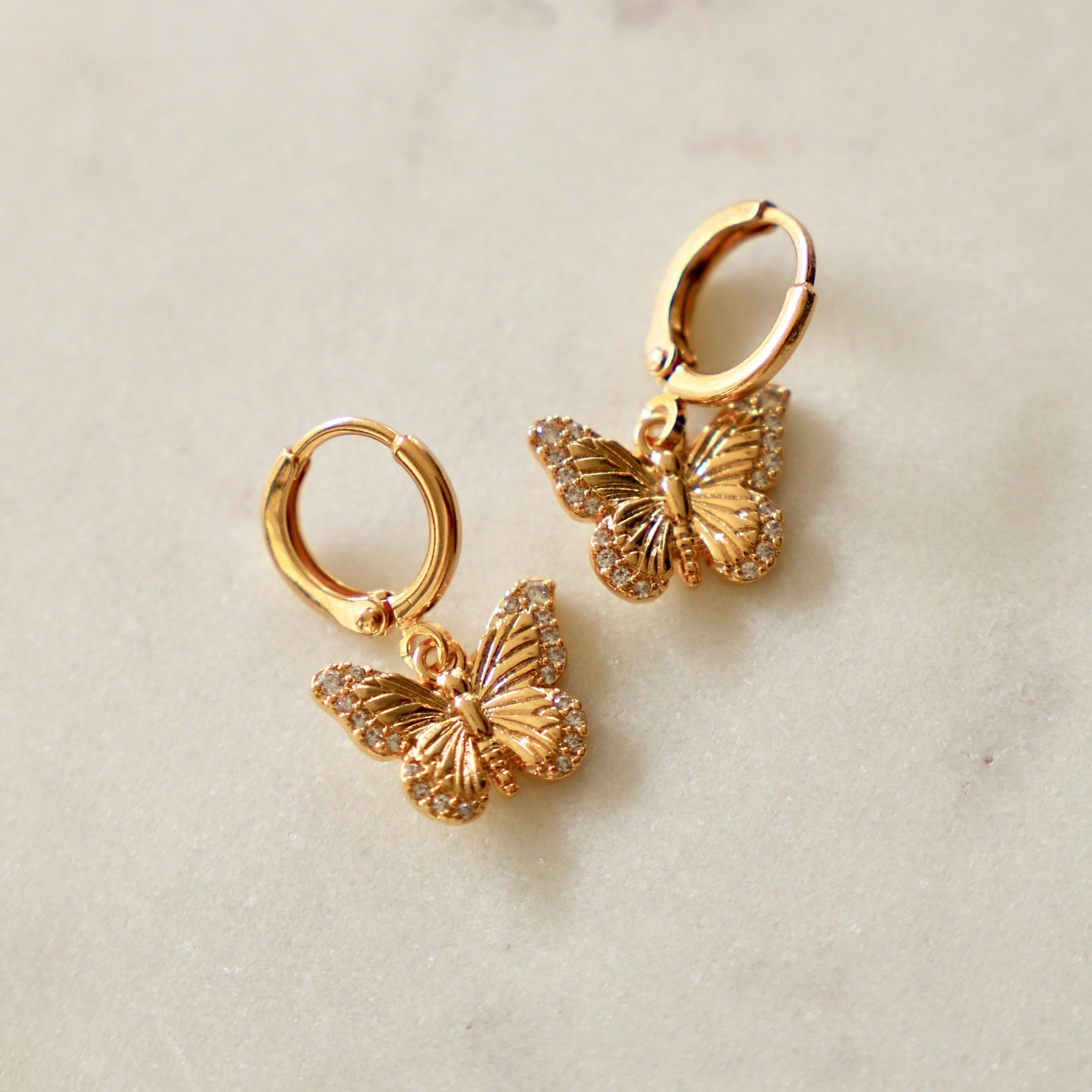 Combining two of our favorite trends, the Butterfly Huggie Hoop Earrings are full of sweet little details. Butterflies are not only beautiful but are full of symbolism representing spiritual rebirth, transformation, change, hope and life.