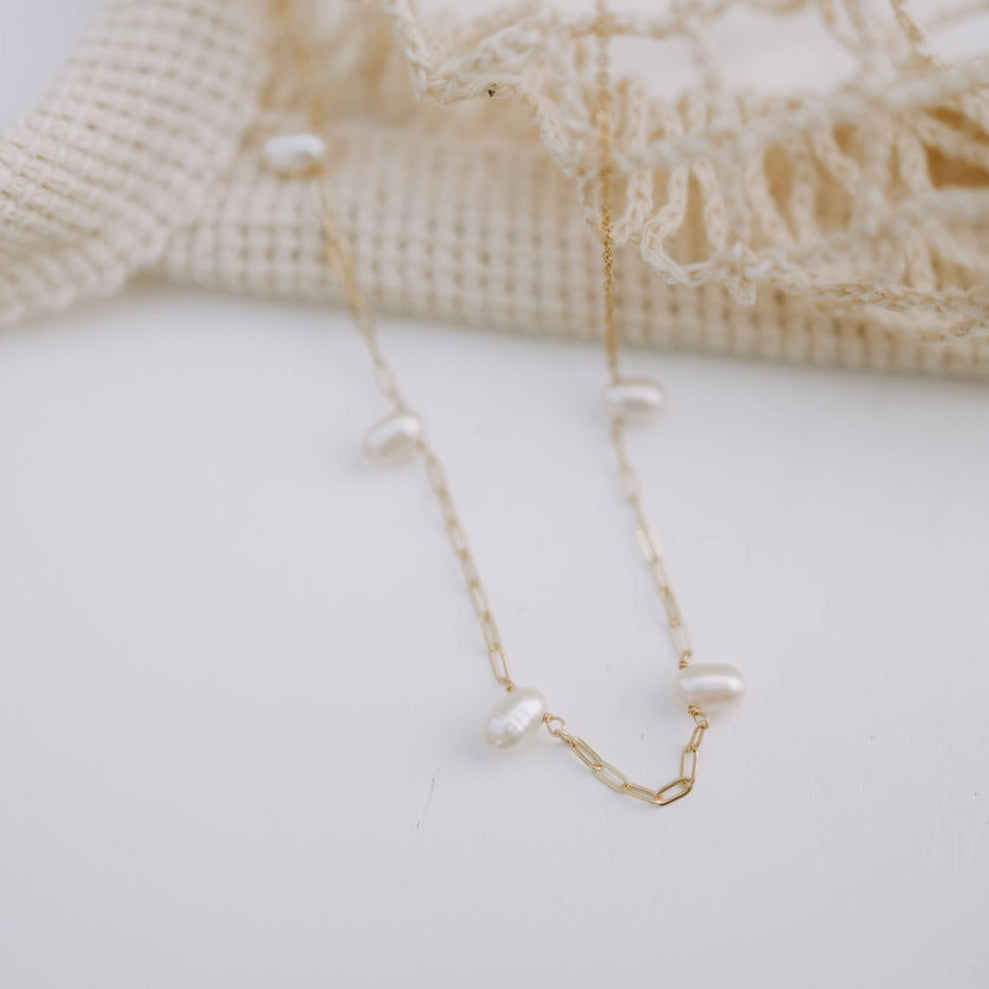 The Adelaide Pearl Necklace combines the best of two jewelry staples: a classic pearl necklace with our best selling paperclip chain. With these two styles of necklaces combined, we know you'll love this necklace that has the best of everything!