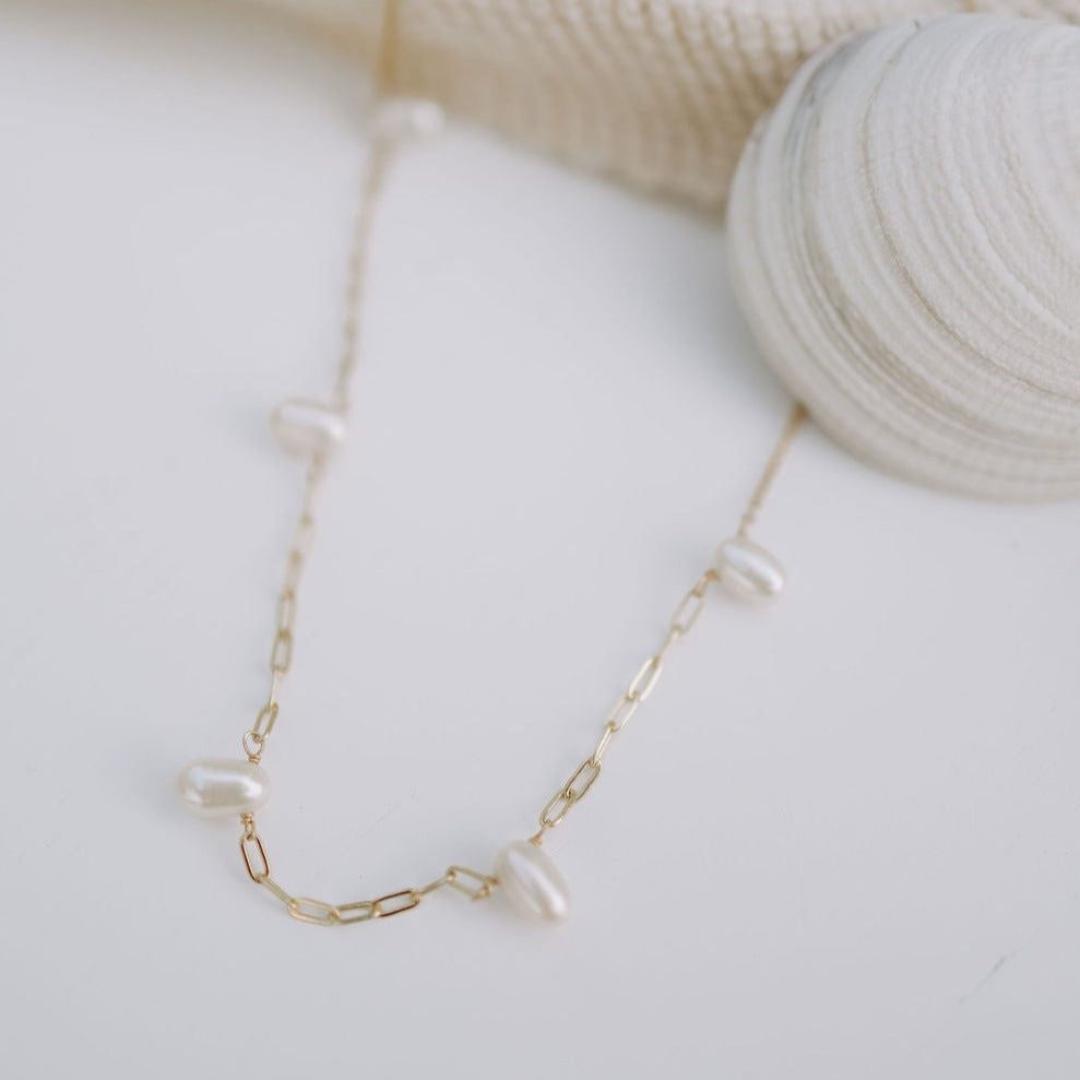The Adelaide Pearl Necklace combines the best of two jewelry staples: a classic pearl necklace with our best selling paperclip chain. With these two styles of necklaces combined, we know you'll love this necklace that has the best of everything!