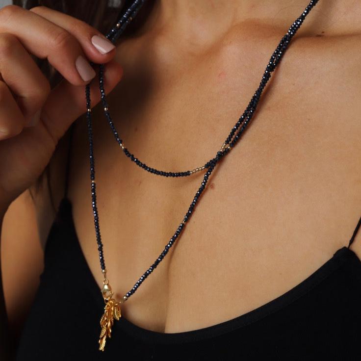Petite hematite crystal wrap necklace with gold filled accent beads and our signature leaf chain ending. Can be worn as a wrap necklace or bracelet.