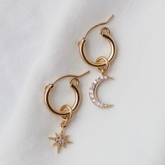 Our most loved earring, the Celestial Star and Moon Hoops are mis-matched perfection. This whimsical pair can be worn together or paired with another style. You can also slide the moon and star charms off for a great staple pair of small hoop earrings.