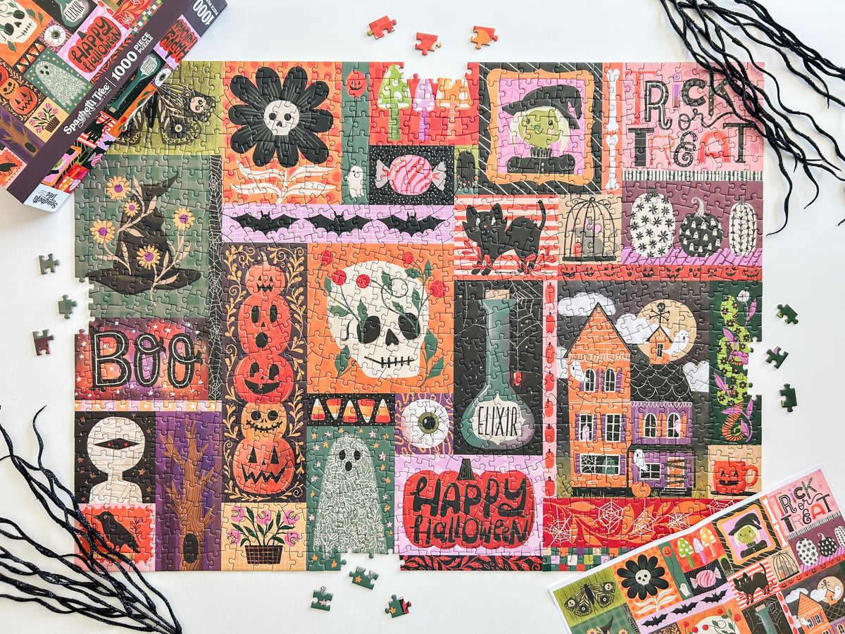 Above view of halloween puzzle. Patchwork style graphics of spooky halloween things like pumpkins, spiders, witches hat, ghost, ect. 