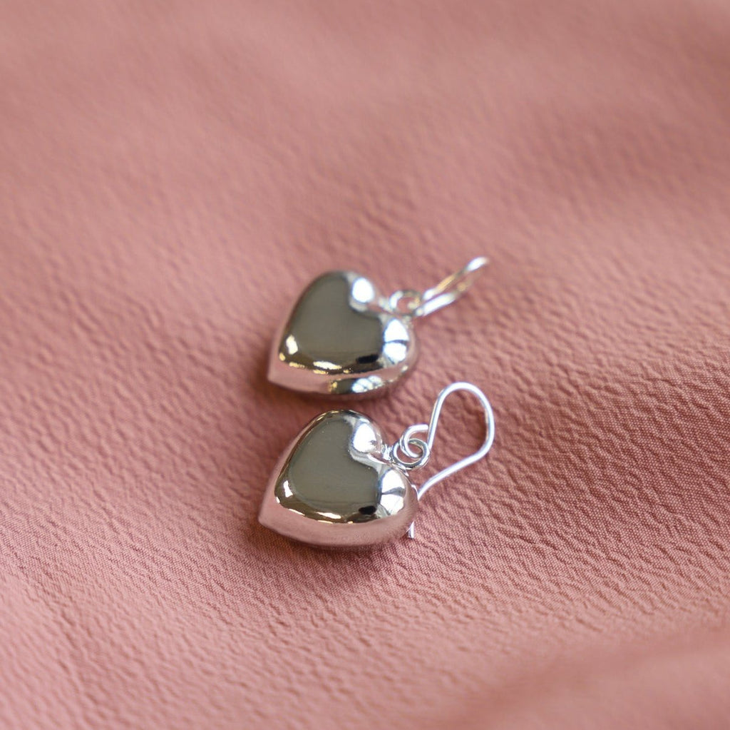 These Lovesick Earrings feature bold, puff heart charms that add a touch of romance to any outfit. Crafted with precision and attention to detail, these earrings are perfect for those who appreciate a sweet yet stylish look. Made with high-quality materials, these earrings are sure to become a staple in your jewelry collection.