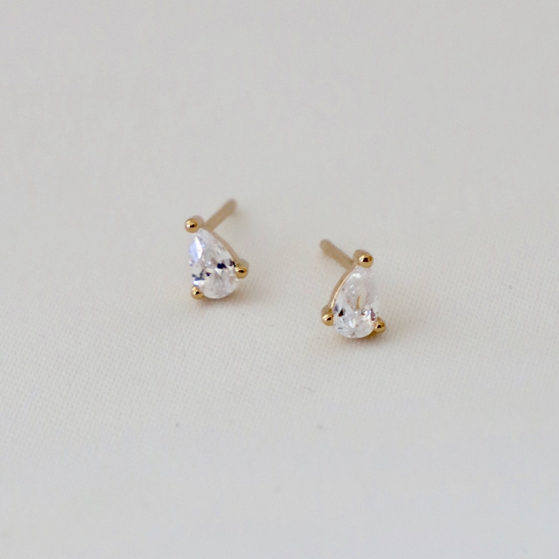 Add a touch of whimsy to your jewelry collection with our Miniature Teardrop CZ Studs! These charming earrings feature delicate teardrop-shaped stones that will add a subtle sparkle to any outfit. The perfect accessory for both casual and formal occasions, these studs are a must-have for any stylish and fun-loving individual!