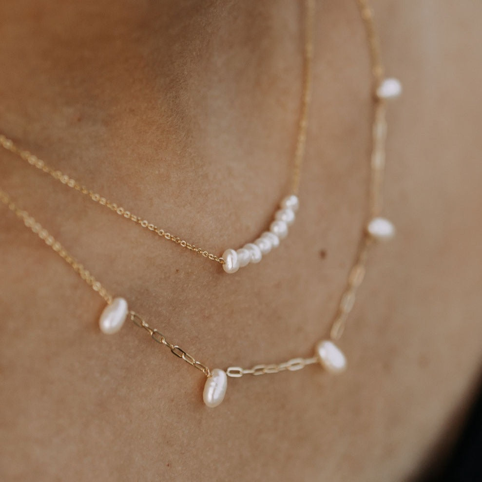 The Adelaide Pearl Necklace combines the best of two jewelry staples: a classic pearl necklace with our best selling paperclip chain. With these two styles of necklaces combined, we know you'll love this necklace that has the best of everything!