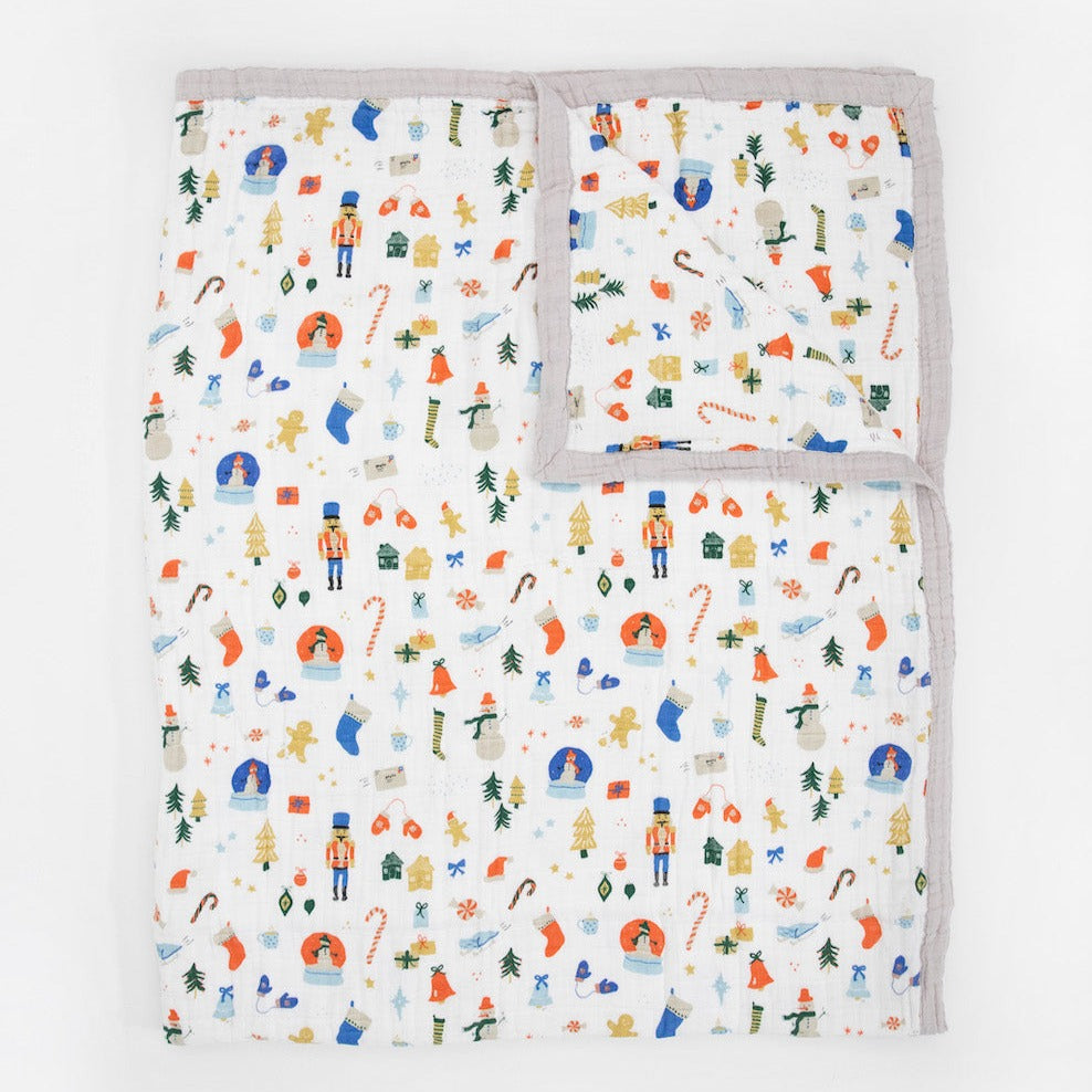Classic quilt supersized! Made for nap time, playtime or anytime. Featuring four breathable layers that get softer with every wash, this versatile throw-sized quilt is an everyday essential. Cotton Muslin Quilted Throw - Christmas Time