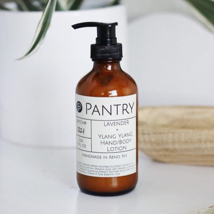 8 fl oz glass pump bottle of lavender + ylang ylang hand and body lotion