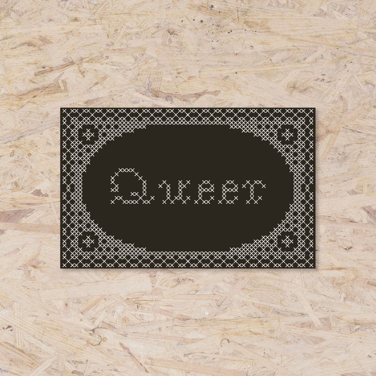 black rectangle sticker with a cross-stitch design reading "Queer".