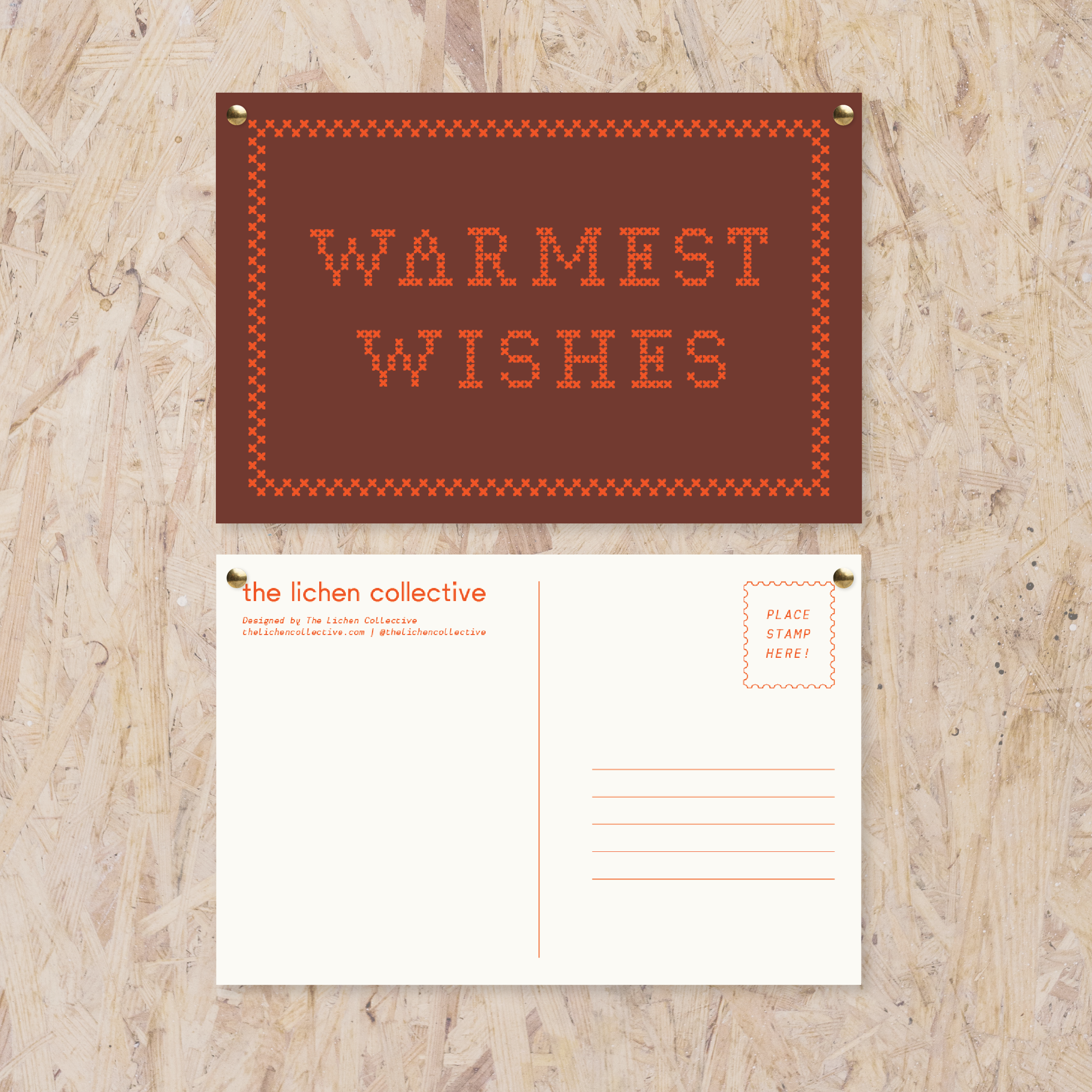 maroon postcard reading "warmest wishes" in a red cross stitch-like font in red