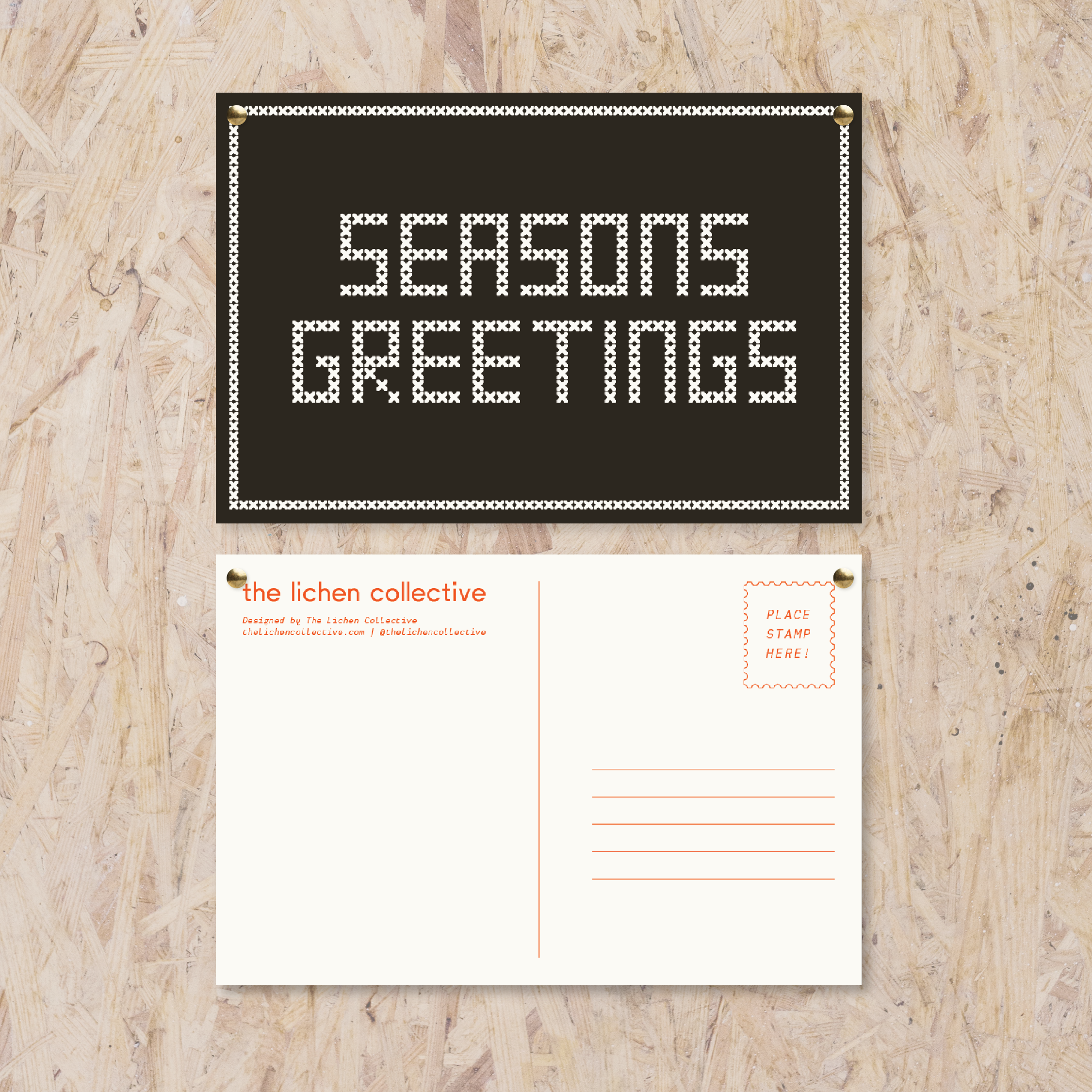 Black postcard reading "seasons greetings" in a white cross stitch-like font