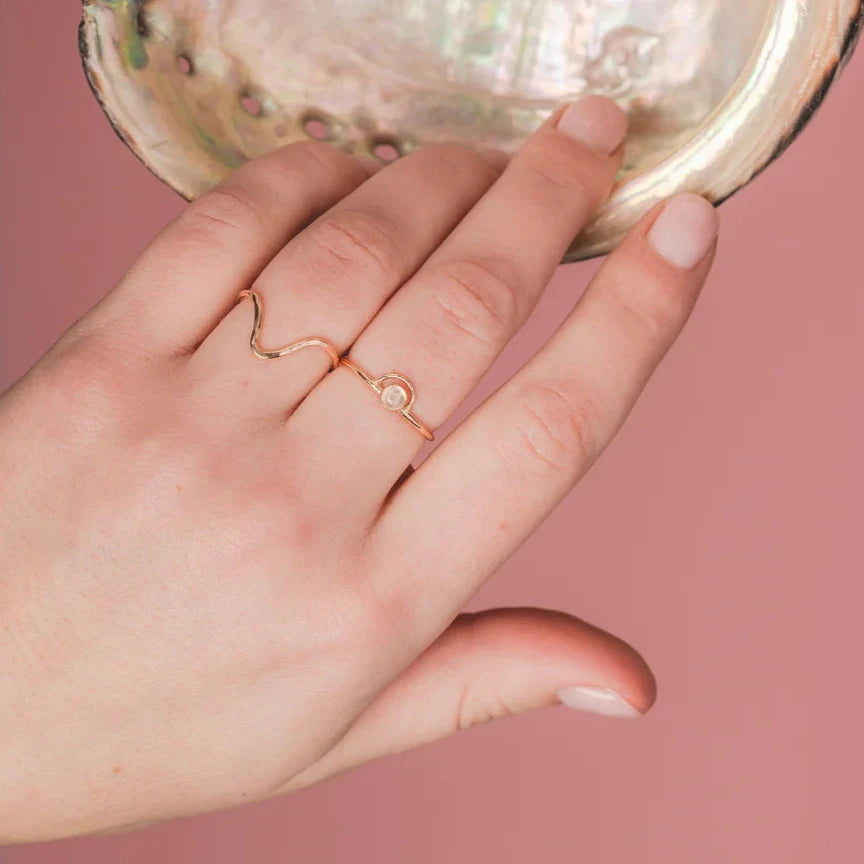 A translucent rainbow moonstone sits in the center of the arc in this ring. An arc is the path above or below the horizon of celestial body, like the sun or moon. Moonstone bestow light, clarity, hope and new beginnings and is the stone connected to the feminine.

Hand-formed, with a bezel and wire in 14k goldfill.


Available in sizes 4-11
16 Gauge wire thickness
4mm rainbow moonstone stone
Polished finish

Made by Mineral and Matter