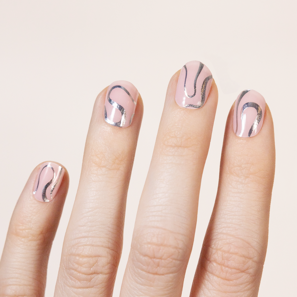 Light pink transparent base with metallic silver foil swirl design.