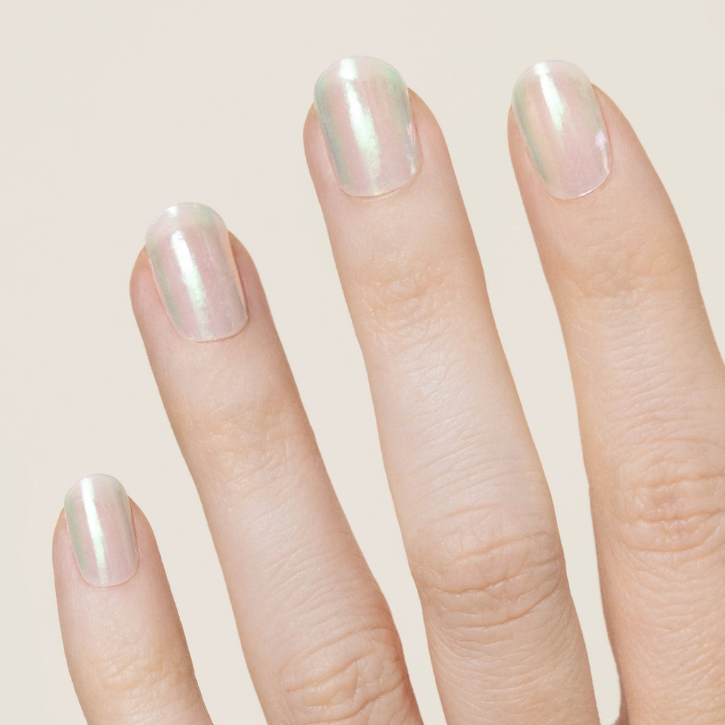 White translucent with a pink and blue iridescent effect that changes in the light!