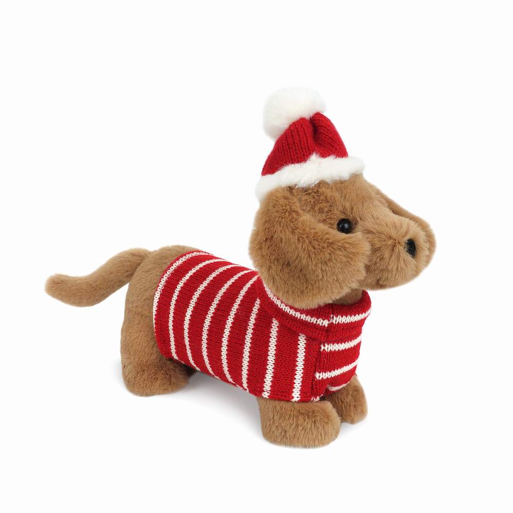 Happy howl-idays! Jingle the Dachshund Christmas Plush Toy is the cutest pup around. No one can resist the adorable puppy eyes, smart holiday sweater and festive Santa hat of our super snuggly dog stuffed animal. Gift our sausage puppy stuffed animal to a little one dreaming of owning a dog or the dachshund lover in your life. Mon Ami’s dog plush toy will have them decking the halls with frisbees and balls.