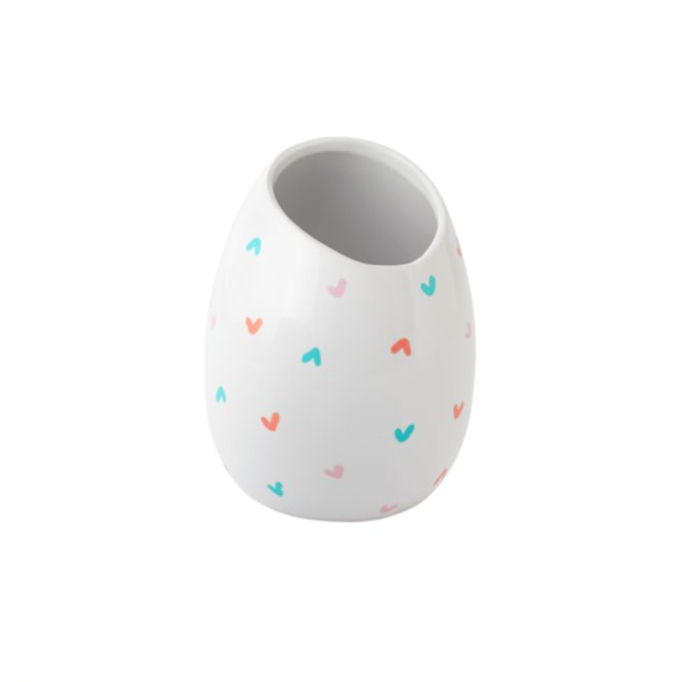 Add some love to your home with our Tiny Heart Vase. This cute and compact vase is perfect for adding a touch of charm to any room. Its small size allows for easy placement on shelves, tables, or even in your office. Spread love and joy with this quirky addition to your decor.