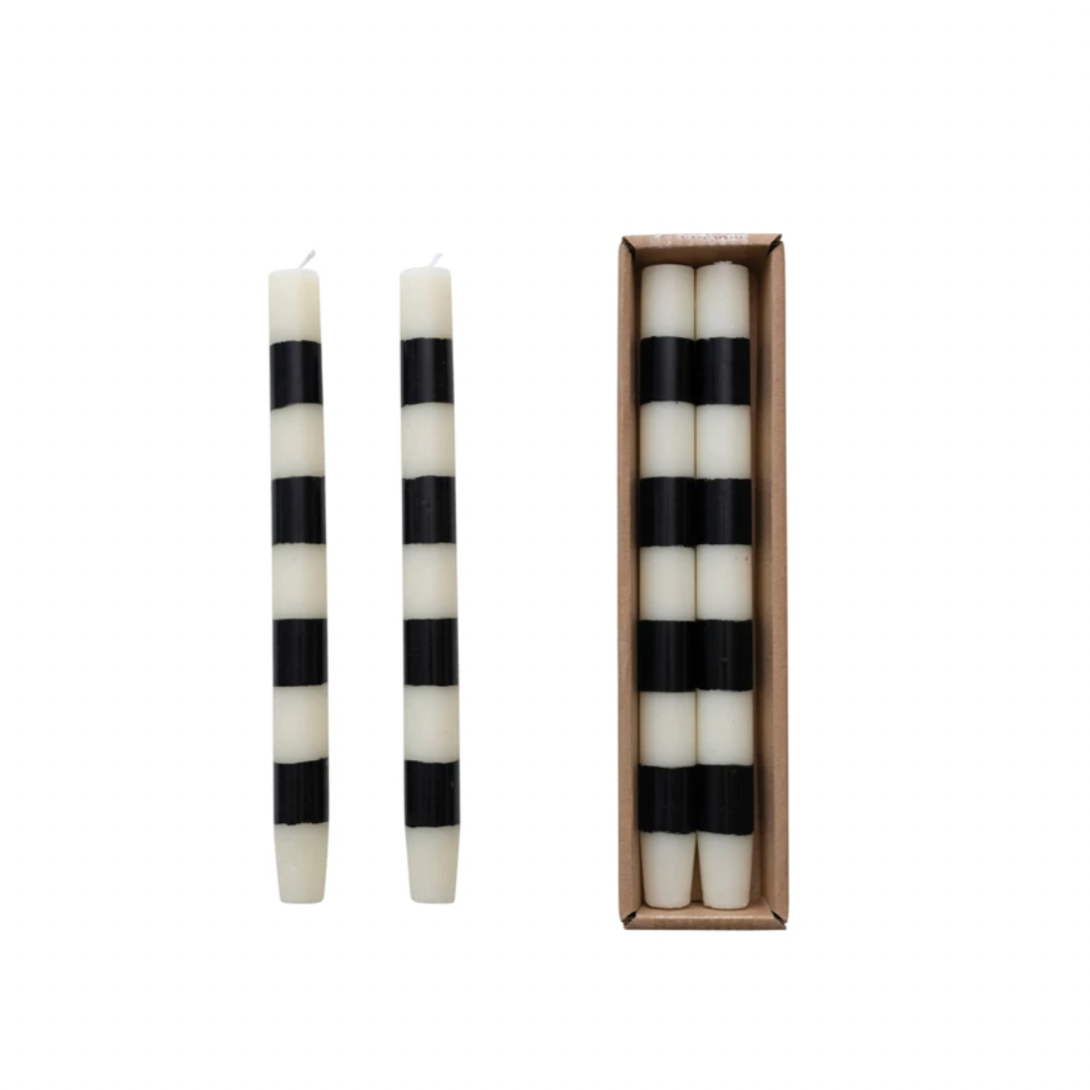 Set the mood with our Unscented Taper Candles featuring playful stripes. Includes a set of two candles in a convenient box. No need for overpowering scents, just enjoy the warm, flickering light. Perfect for any occasion, without taking itself too seriously. Black &amp; White Stripes