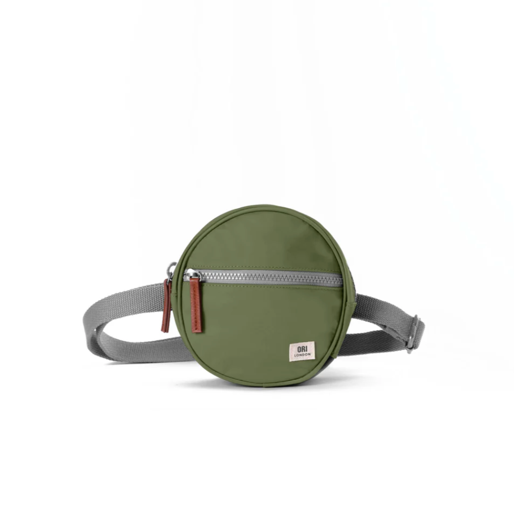 With a front zip pocket, a secret pocket inside, and plenty of space for your keys, sunglasses, and mobile phone this little hip bag is going to change your life in a big way! With an adjustable waist strap and sturdy zips, this little treasure is made with weather-resistant, recycled nylon material.