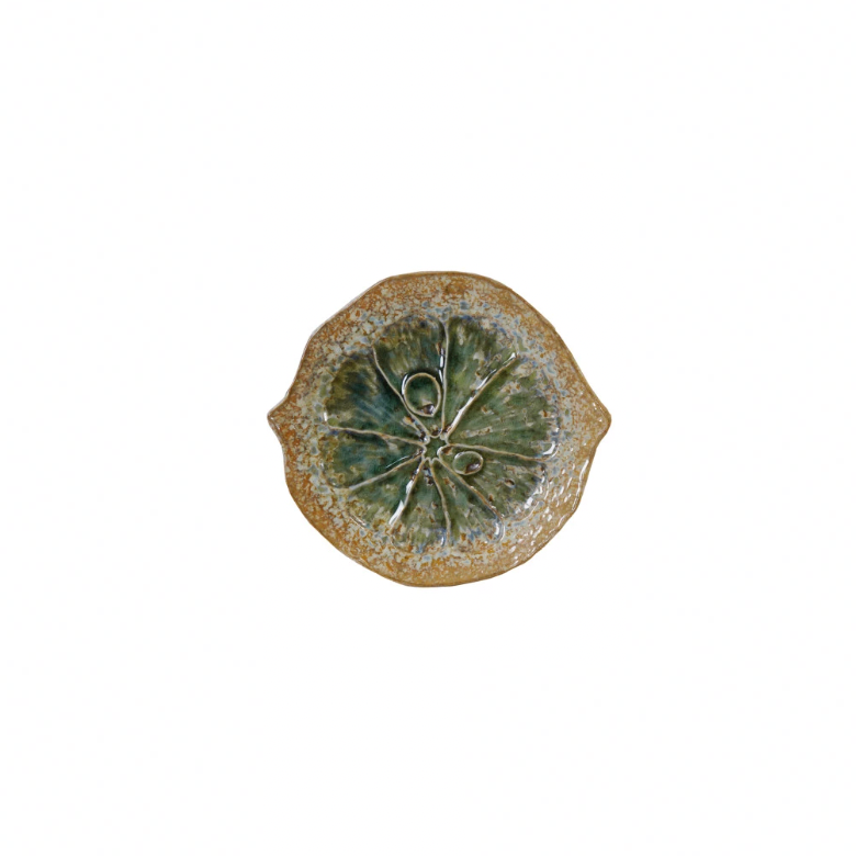 Brighten up your table with our Stoneware Citrus Shaped Plate! Available in 3 vibrant colors, this playful and quirky plate will bring a pop of fun to any meal. Made from durable stoneware, it's perfect for serving up all your favorite dishes. Add a slice of happiness to your dining experience today! 6-3/4"L x 6"W. Green