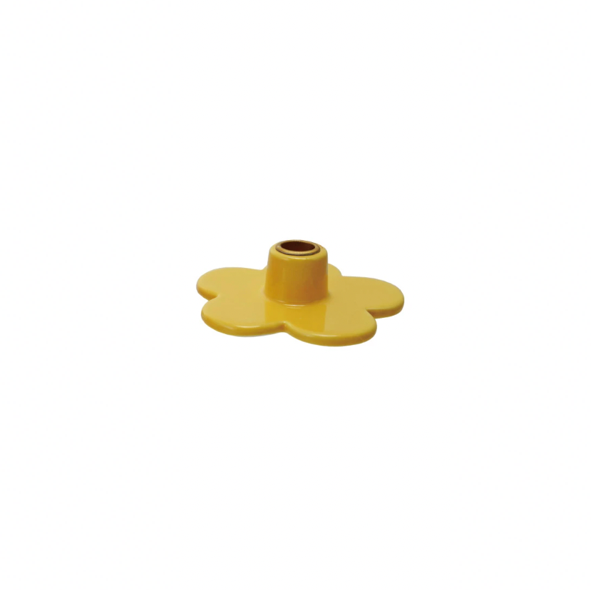 Add a touch of whimsy to your decor with our Stoneware Flower Shaped Taper Holder, available in 3 colors. This holder not only holds your taper candles securely, but also doubles as a charming tabletop accent. Brighten up any room with this playful and unique piece! 3"L x 3"W.  Yellow